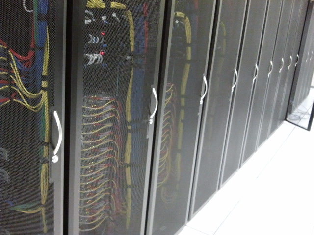Server rack with network cabling, Voaas IT support hero image